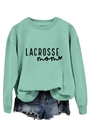 Close-up of light green crewneck sweatshirt featuring Lacrosse Mom text and heart print - Light Green Sweatshirt (Black Font)