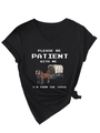 Detail of V-neck black T-shirt featuring Please Be Patient print and stylish hem knot - Black
