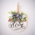 Round wooden welcome sign with green foliage and striped bow for home entrance - Blessing Style (Bless This Home)