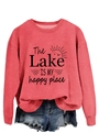 Close-up of 'The Lake IS MY happy place' print on red crewneck long sleeve sweatshirt - Red (Black Print)