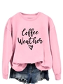 Detail of pink sweatshirt with Coffee Weather print, ribbed cuffs, and frayed denim shorts - Pink (Black Text)