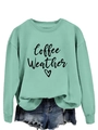 Detail of mint green sweatshirt with Coffee Weather print tucked into denim shorts - Light Green (Black Text)