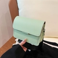 Mint green leather crossbody bag with quilted stitching and adjustable shoulder strap - Green