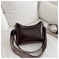 Detail of dark brown glossy hobo bag featuring wide woven strap and gold metal hardware - Dark Brown