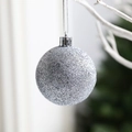 Elegant silver glitter Christmas bauble ornament hanging on a snowy white branch - Glitter Silver 3cm (Pack of 12)