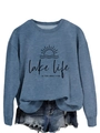 Close-up of Lake Life Is The Best Life graphic print on a blue long-sleeve sweatshirt - S / Blue (Black Font)