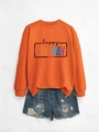 Detailed flat lay of bright orange Happy Fri-yay sweatshirt with colorful lettering print - Orange Sweatshirt (Black Text Graphic)