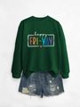 Detailed flat lay of dark green sweatshirt with colorful happy fri yay text and ripped denim shorts - Dark Green Sweatshirt (White Text)