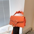 Chic orange quilted crossbody bag with pleated cloud handle and gold buckle detail - Orange