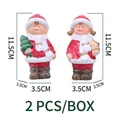 Christmas ceramic boy and girl figurines with snow texture and festive red outfits - 11.5cm Height / Boy And Girl Ceramic Ornaments Pair