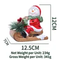 Ceramic Christmas snowman on brown sled with green scarf and red hat figurine - Sledding Snowman / Light-up Style