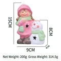 Luminous ceramic girl Christmas ornament with pink hat and scarf, 15cm height variant - 5217B Girl With Snowman