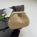 Detail of hand-woven beige straw shell bag with rigid handle and gold chain strap - Off White