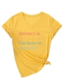 Close-up of bright yellow V-neck T-shirt with literacy slogan and stylish front knot - S / Yellow