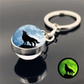 Luminous howling wolf keychain with silver metal base and green glow in the dark effect - Solitary Shadow Wolf Moon (XSWX2748-3)