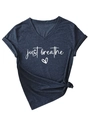 Detail of V-neck short sleeve tee featuring just breathe slogan and stylish knotted hem - Navy Blue