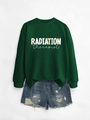 Detailed flat lay of green Radiation Therapist sweatshirt with distressed denim shorts - Dark Green Sweatshirt (White Text)