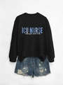 Detail view of ICU NURSE intensive care unit typography on black crewneck sweatshirt - Black (White Print)