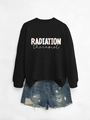 Flat lay of black radiation therapist sweatshirt paired with distressed denim shorts - Black Sweatshirt (White Text)