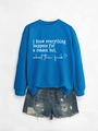 Royal blue sweatshirt with white text paired with distressed denim shorts on grey background - Lake Blue Sweatshirt (White Font)