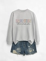 Flat lay of gray radiation therapist sweatshirt paired with distressed denim shorts - Grey Sweatshirt (Black Text)