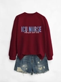 Close-up of ICU NURSE print on a burgundy crewneck sweatshirt with casual denim shorts - Wine Red (White Print)