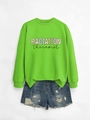 Detail of lime green crewneck sweatshirt with Radiation Therapist print and denim shorts - Neon Green Sweatshirt (Black Graphic)