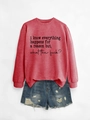 Detail of red crewneck sweatshirt with black slogan and distressed denim shorts - Red Sweatshirt (Black Font)