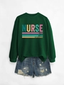 Flat lay of green nurse sweatshirt with caring loyal strong print and denim shorts - Dark Green