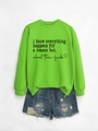 Flat lay of neon green crewneck sweatshirt with text and distressed denim shorts set - Fluorescent Green Sweatshirt (Black Font)