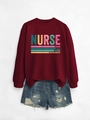 Detail of burgundy sweatshirt with Nurse lettering paired with ripped denim shorts - Burgundy
