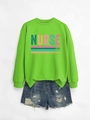 Flat lay of a neon green nurse sweatshirt with caring loyal strong print and denim shorts - Fluorescent Green