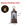 Bronze vintage Christmas lantern featuring a decorative tree and warm LED lighting effect - Large Bronze Christmas Tree