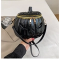 Detail of the shiny black patent leather pumpkin bag with 3D face and gold zippers - Black