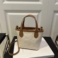 Chic cream and brown contrast tote bag with embossed butterfly motifs and crossbody strap - White