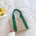 Handmade straw tote bag with vibrant green fabric handles for summer beach vacations - Green