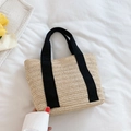 Handcrafted straw tote bag with black fabric handles for summer beach vacations - Black