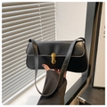 Detail of black faux leather underarm bag with gold metal twist lock and smooth texture - Black