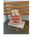 Detail of colorful woven mini bucket bag with pearl handle and golden chain strap - Rose Red