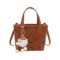 Brown mini bucket bag with cartoon puppy prints and white plush pendant accessory - With Pendant / Brown