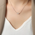 Elegante collana d'argento con pendente a onde intrecciate e catena a serpente in acciaio - Grande / Colore acciaio