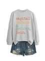 Close-up of light grey sweatshirt with colorful text and distressed denim shorts - Gray