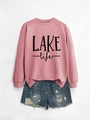 Detail of Lake Life print on pink sweatshirt paired with distressed denim shorts - Rose Gold Sweatshirt (Black Print)