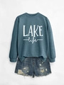Close-up of Lake Life printed sweatshirt with crew neck and ribbed cuffs detail - Blue Sweatshirt (White Print)