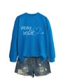 Detail of royal blue Vacay Mode sweatshirt with airplane heart and distressed denim shorts - Lake Blue (White Graphic)