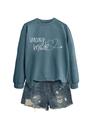 Detail view of blue-gray Vacay Mode sweatshirt paired with distressed denim shorts - Blue (White Print)