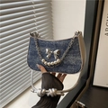 Blue denim underarm bag featuring silver butterfly bow and pearl chain strap - Blue