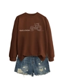 Close-up of the tractor print and 'thank a farmer' text on this brown casual sweatshirt - Coffee (White Print)