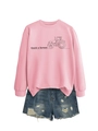 Detail view of pink crewneck sweatshirt with 'thank a farmer' text and ripped denim shorts - Pink (Black Print)
