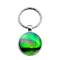 Silver metal keychain with round glass pendant featuring green Northern Lights design - Green Aurora Over Lake Style (XSWX4881-1)